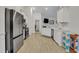 Open concept kitchen with stainless steel appliances and white cabinets at 516 Yellow Leaf Ln, Summerville, SC 29486