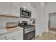 Modern kitchen with stainless steel appliances and white shaker cabinets at 516 Yellow Leaf Ln, Summerville, SC 29486