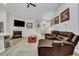 Living room features hardwood floors, a brown leather sectional sofa and a gas fireplace at 516 Yellow Leaf Ln, Summerville, SC 29486