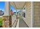 Covered front porch with stone pillars and railing at 516 Yellow Leaf Ln, Summerville, SC 29486