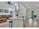 Open concept kitchen with island and breakfast bar, flows into living room at 516 Yellow Leaf Ln, Summerville, SC 29486