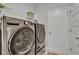 Laundry room with LG washer and dryer, and built in shelving at 516 Yellow Leaf Ln, Summerville, SC 29486