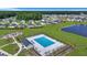 Aerial view of community pool, playground, pond and homes at 516 Yellow Leaf Ln, Summerville, SC 29486