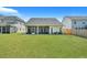 Large backyard with home and wooden fence at 516 Yellow Leaf Ln, Summerville, SC 29486