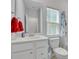 Clean bathroom with white vanity, red towels, and a shower/tub combo at 516 Yellow Leaf Ln, Summerville, SC 29486