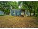 Home's back exterior, showcasing a large backyard at 2355 Cambridge Ave, North Charleston, SC 29405