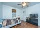 Bedroom with wood floors, ceiling fan, and built-in storage at 2355 Cambridge Ave, North Charleston, SC 29405