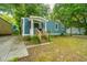 Blue house with a wooden porch and a grassy yard at 2355 Cambridge Ave, North Charleston, SC 29405