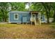 Home's back exterior with a wooden deck at 2355 Cambridge Ave, North Charleston, SC 29405
