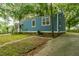 Blue house with a wooden porch and a grassy yard at 2355 Cambridge Ave, North Charleston, SC 29405
