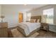 Cozy bedroom with wood floors and en-suite bath at 2332 Macallan Blvd, Ravenel, SC 29470