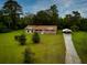 Ranch house with brick exterior, detached garage, and large yard at 840 Brittlebank Rd, Walterboro, SC 29488