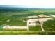 Aerial view of a large undeveloped area with cleared lots and trees at 5528 Bowmore Blvd, Ravenel, SC 29470