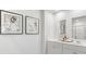 Bathroom with double vanity and large mirrors at 5528 Bowmore Blvd, Ravenel, SC 29470