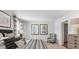 Main bedroom with a king-size bed and ensuite bathroom at 5528 Bowmore Blvd, Ravenel, SC 29470
