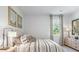 Bright bedroom with a queen-size bed and neutral decor at 5528 Bowmore Blvd, Ravenel, SC 29470