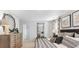 Spacious bedroom with dresser and large bed at 5528 Bowmore Blvd, Ravenel, SC 29470