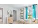 Bedroom with twin bed and teal curtains at 5528 Bowmore Blvd, Ravenel, SC 29470