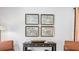 Entryway with console table and vintage-style maps at 5528 Bowmore Blvd, Ravenel, SC 29470