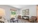 Relaxing living room with hardwood floors, neutral decor, and ample natural light at 5528 Bowmore Blvd, Ravenel, SC 29470
