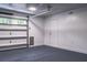 Bright garage with open overhead door, gray flooring, and white walls at 111 Garden Hill Rd, Summerville, SC 29483