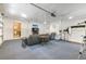 Spacious garage, partially finished, with lounge area and photography setup at 111 Garden Hill Rd, Summerville, SC 29483