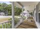 Spacious front porch with white columns and wooden flooring at 108 N Norfolk Way, Goose Creek, SC 29445