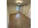 Well-lit bedroom with hardwood floors and barn door at 106 Carmon St, Summerville, SC 29485