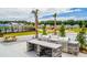 Outdoor grilling area with stone countertops and picnic tables at 506 Golden Embers Way, Summerville, SC 29486