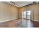Spacious living room with large window and balcony access at 150 Bee Street # 614, Charleston, SC 29401