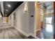 Modern hallway with gray carpeting and contemporary lighting at 150 Bee Street # 614, Charleston, SC 29401