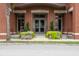 Brick building with glass doors, planters, and steps at 150 Bee Street # 614, Charleston, SC 29401