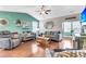 Spacious living room with hardwood floors, teal walls, and comfortable seating at 515 Alderly Dr, Moncks Corner, SC 29461