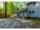 Backyard patio, partially covered with a wooden fence and trees at 107 Tryon Dr, Summerville, SC 29485