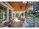 Relaxing deck with seating area and spiral staircase at 3006 Cameron Blvd, Isle of Palms, SC 29451