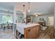 Open kitchen with farmhouse sink and views into living room at 213 Blue Heron Dr, Summerville, SC 29485