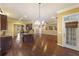 Open concept kitchen with island and hardwood floors at 105 Covey Rise Ct, Summerville, SC 29485