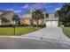 Two-story house with a front porch, driveway, and palm trees at 105 Covey Rise Ct, Summerville, SC 29485