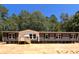 Single-Gathering home with gray siding and a wooden deck at 928 Tiger Loop, Saint Stephen, SC 29479