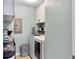 Bright laundry room with washer, dryer, and shelving at 1841 Gammon St, Charleston, SC 29414