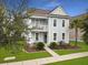 Charming two-story home with light blue siding, front porch and landscaping at 1841 Gammon St, Charleston, SC 29414