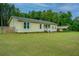 Beige one-story home with carport and fenced yard at 3279 Wire Rd, Saint George, SC 29477