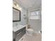 Small bathroom with a toilet, sink, and black and white tile floor at 227 St Margaret St, Charleston, SC 29403