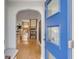 Open entryway with blue door, hardwood floors and view of staircase at 227 St Margaret St, Charleston, SC 29403