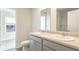 Bathroom with double vanity, gray cabinets and shower at 6277 Gritman Dr, Hollywood, SC 29470