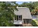 Elevated view of condo building showcasing balcony and surrounding trees at 1616 Live Oak Park, Seabrook Island, SC 29455
