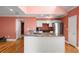 Open kitchen with granite countertops, stainless steel appliances, and hardwood floors at 1616 Live Oak Park, Seabrook Island, SC 29455