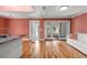 Spacious living area with hardwood floors and sliding glass doors leading to a deck at 1616 Live Oak Park, Seabrook Island, SC 29455