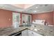 Open kitchen with granite countertops, stainless steel appliances, and hardwood floors at 1616 Live Oak Park, Seabrook Island, SC 29455