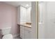 Bathroom with granite countertop, white cabinets, and shower at 1616 Live Oak Park, Seabrook Island, SC 29455